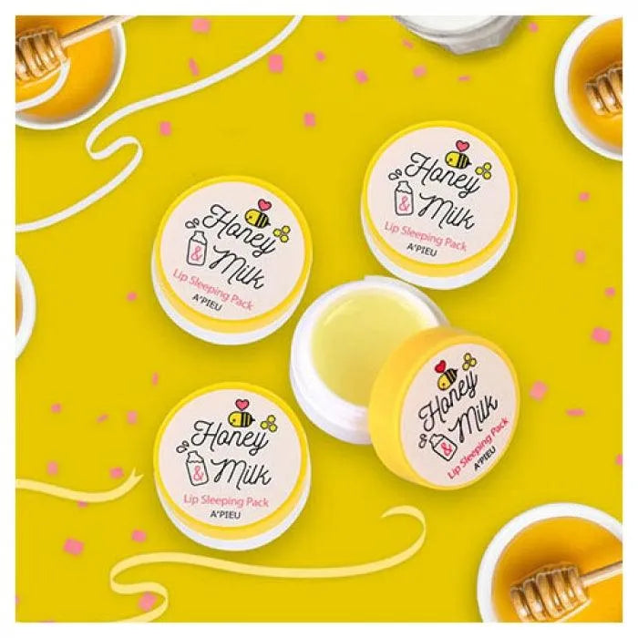 A'Pieu Honey and Milk Lip Sleeping Pack Korean skincare on yellow background with honey dipper