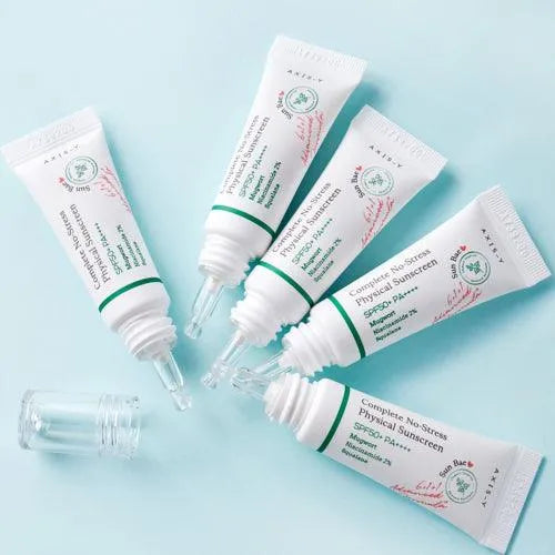 Axis-Y Complete No-Stress Physical Sunscreen tubes on a light blue background at Me Time Groningen