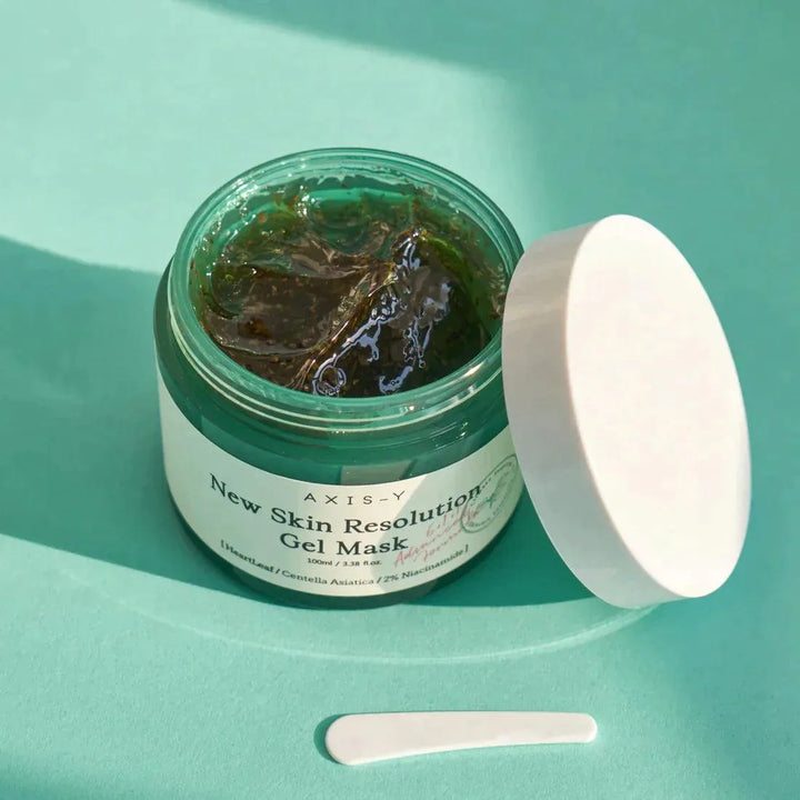 AXIS-Y New Skin Resolution Gel Mask open jar on green background, Korean skincare product