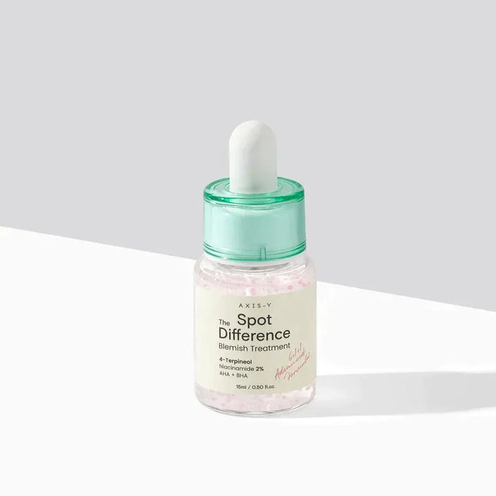 AXIS-Y Spot The Difference Blemish Treatment serum bottle on white surface, Korean skincare product at Me Time Groningen