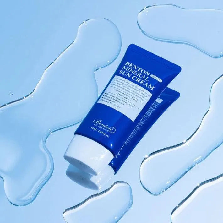 Benton Mineral Sun Cream tube on a watery blue background, Korean skincare Nederland product.