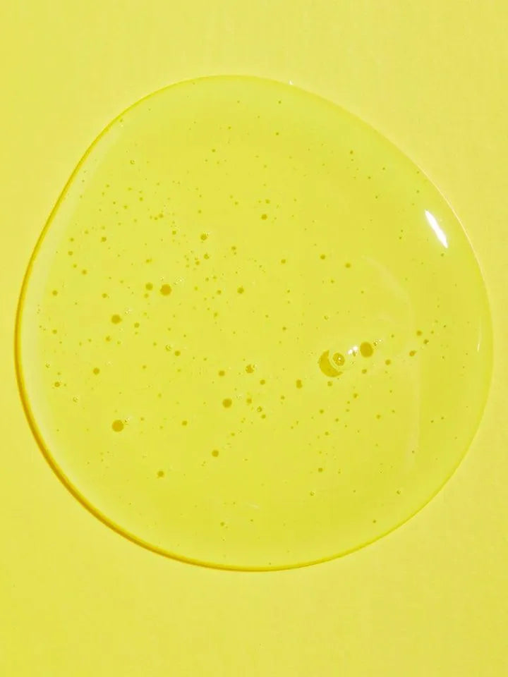 Clear yellow gel texture of Korean skincare cleanser on bright yellow background