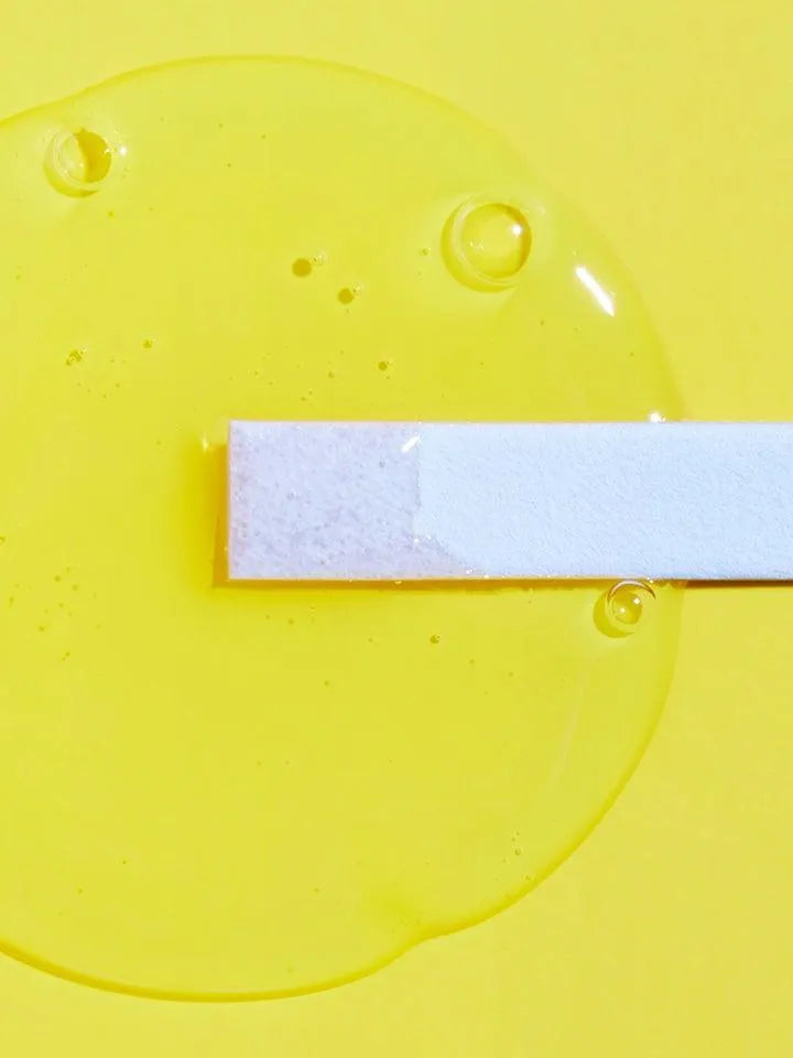 Yellow gel cleanser with pH test strip on a bright background, Korean skincare Me Time Groningen