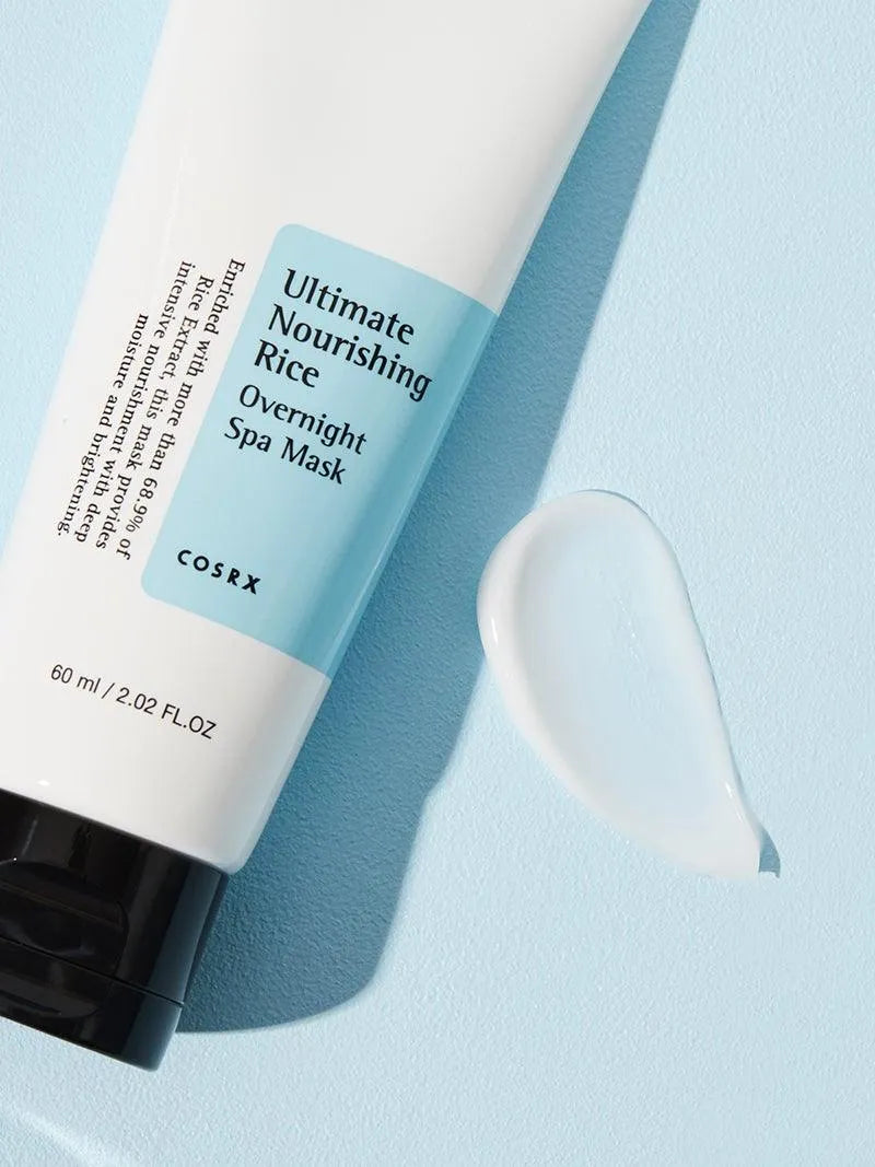 COSRX Ultimate Nourishing Rice Overnight Spa Mask tube on light blue background, Korean skincare product