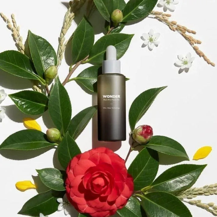 Haruharu Wonder Black Rice Facial Oil bottle on leaves and flowers, Korean skincare Netherlands