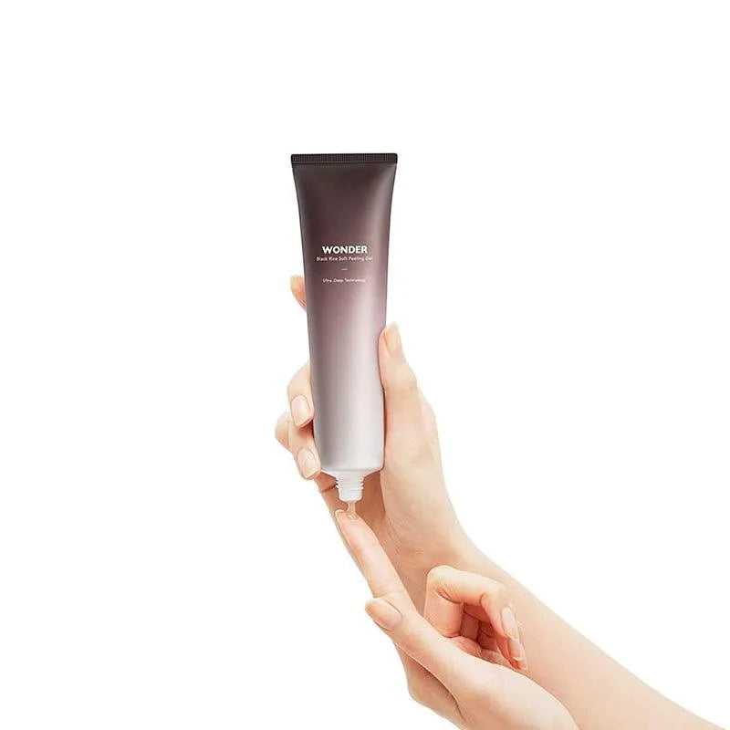 Hand holding Haruharu Wonder Black Rice Soft Peeling Gel tube, Korean skincare product