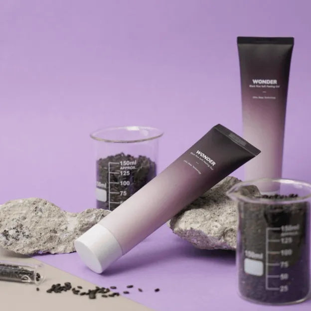 Haruharu Wonder Black Rice Soft Peeling Gel Korean skincare on purple background with black rice and beakers at Me Time Groningen