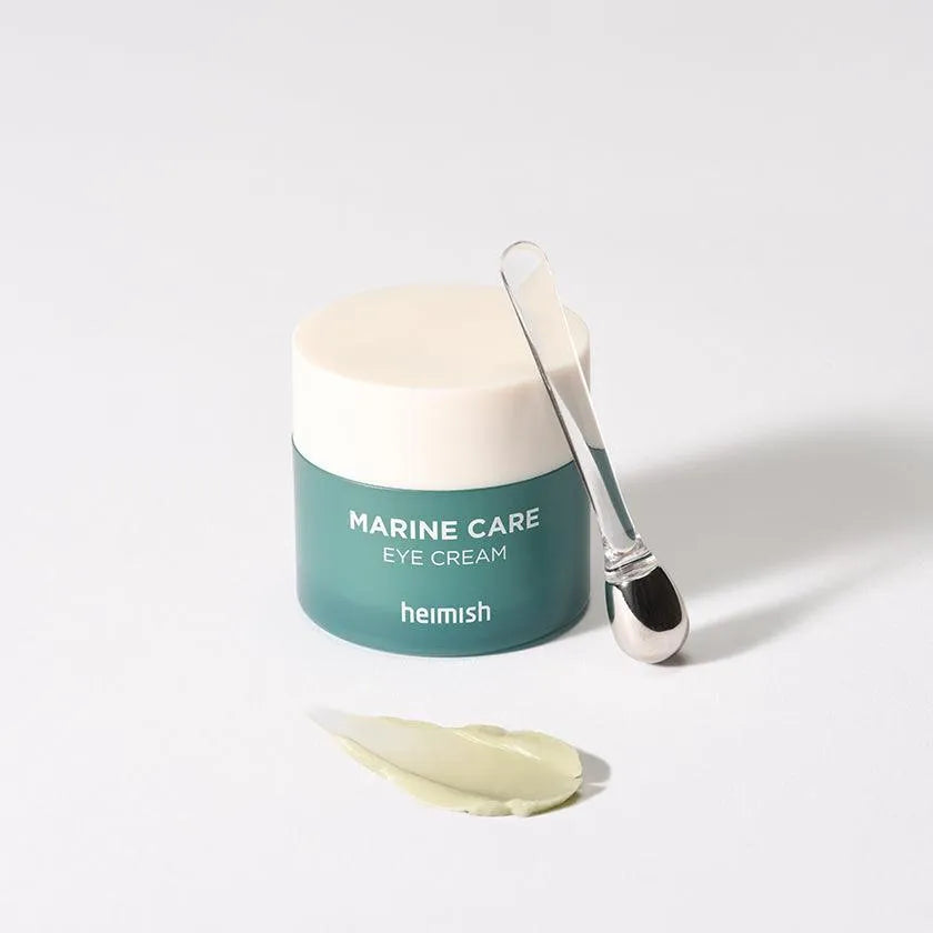 Heimish Marine Care Eye Cream jar with applicator and cream on white background, Korean skincare