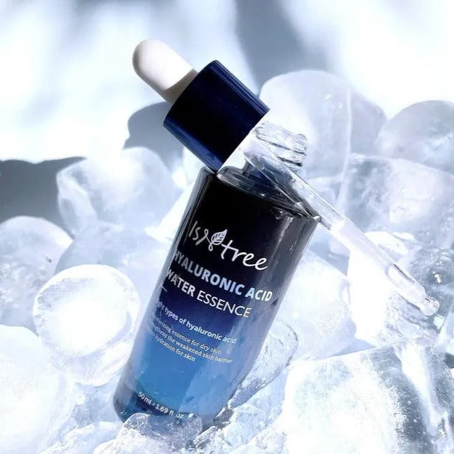 Isntree Hyaluronic Acid Water Essence bottle with dropper on ice, Korean skincare product