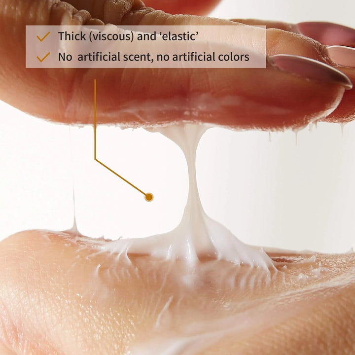 Close-up of iUNIK Black Snail Restore Cream texture, thick and elastic, on fingers, Korean skincare from Me Time Groningen.