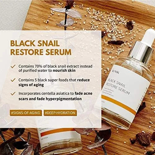iUNIK Black Snail Restore Serum bottle on wooden desk, Korean skincare at Me Time Groningen, Nederland.