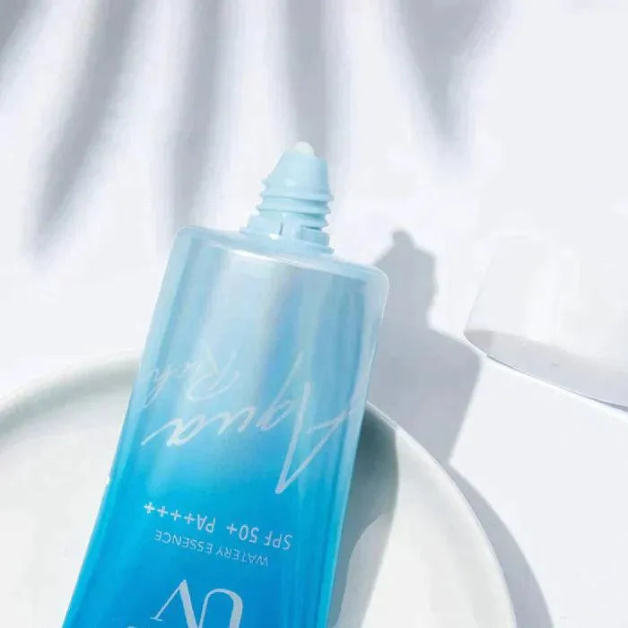 Kao Biore UV Aqua Rich Watery Essence SPF 50 tube on white plate, Korean skincare product
