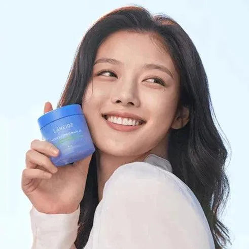 Young woman smiling and holding Laneige Water Sleeping Mask, Korean skincare at Me Time Groningen