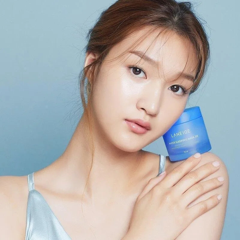 Woman with glowing skin holding Laneige Water Sleeping Mask, Korean skincare at Me Time Groningen