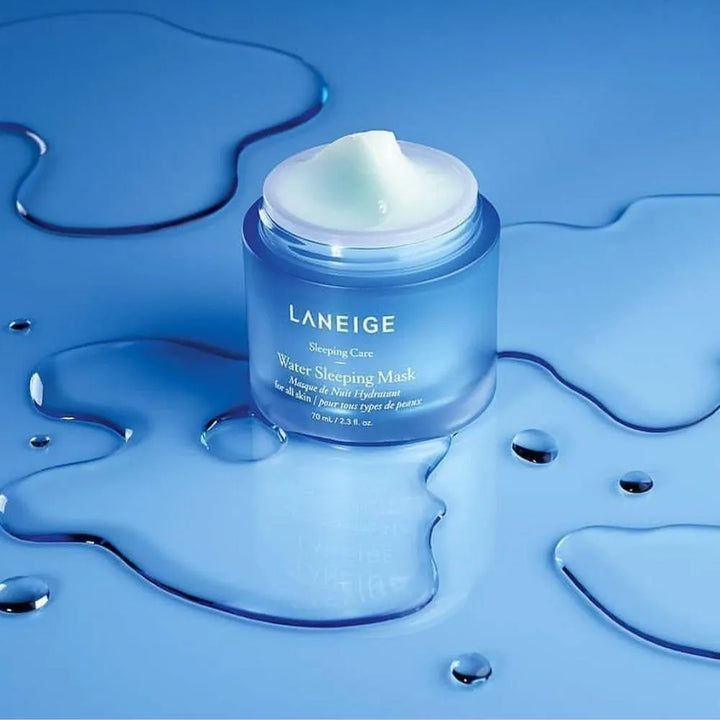 Laneige Water Sleeping Mask jar on glossy blue surface with water drops, Korean skincare product