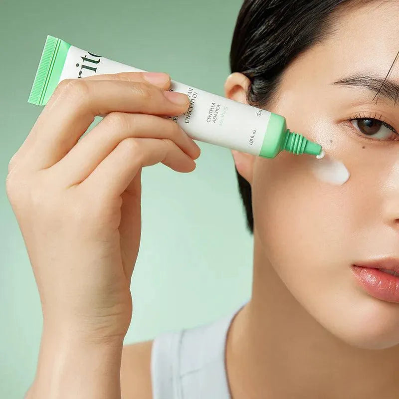 Person applying Purito Wonder Releaf Centella eye cream, Korean skincare at Me Time Groningen