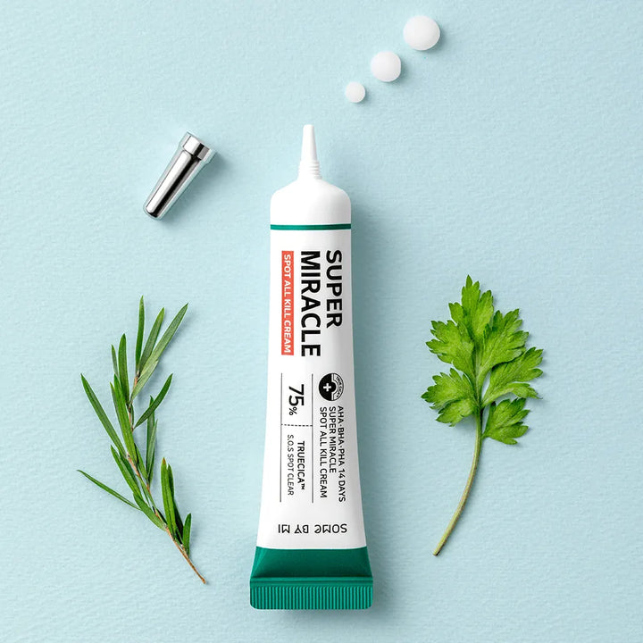 Some By Mi AHA BHA PHA Super Miracle Spot All Kill Cream tube on blue background with herbs, Korean skincare Me Time Groningen