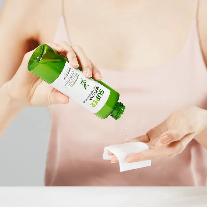 Pouring Some By Mi Super Matcha Pore Tightening Toner onto a cotton pad, Korean skincare
